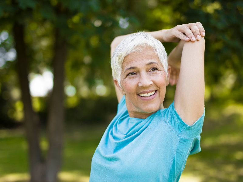 Mature woman walking confidently after non-surgical muscle toning treatment in Brisbane