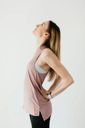 Woman smiling and walking comfortably after TeslaFormer treatment session